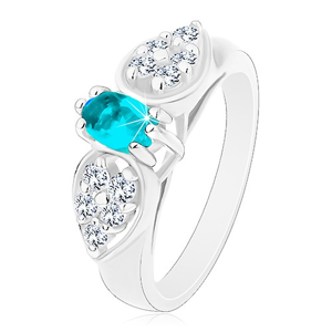 Lesklý prsten ve stříbrném odstínu, blýskavá mašlička s modrým oválem - Velikost: 52
